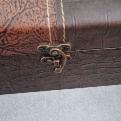 Wooden box with leather-like covering and metal handles