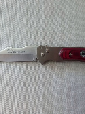 Automatic folding knife like new with wooden handle and compass
