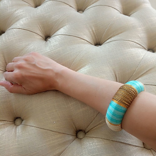 Boho chic thread-wrapped bangle like new, turquoise and gold
