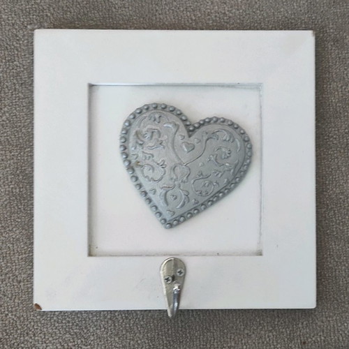 Picture frame hanger used with corner wear