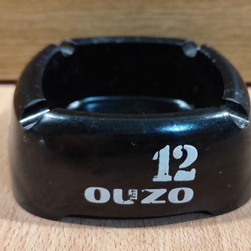 Ouzo 12 square black plastic ashtray used