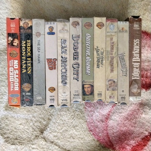 Set of 11 authentic VHS tapes with classic adventure movies like new