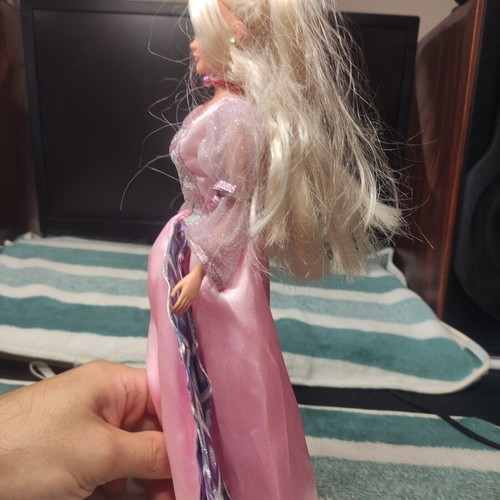 Doll with beautiful dress used