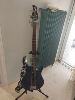 Yamaha electric bass with Fender case and strap