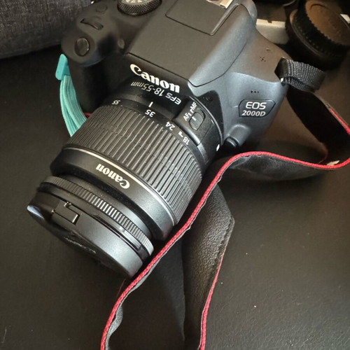 Canon EOS 2000D camera with 3 batteries and extras, like new