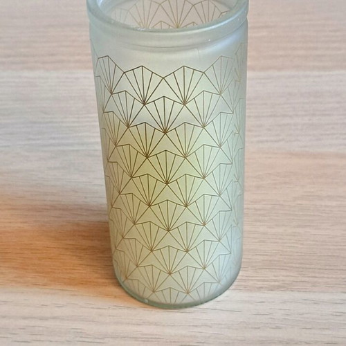 White candle in container new