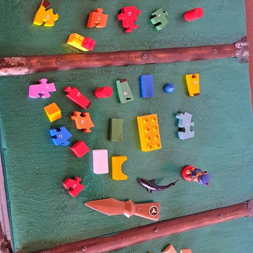 Various puzzles used, assorted toys