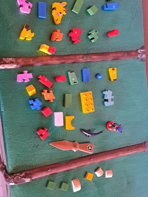 Various puzzles used, assorted toys