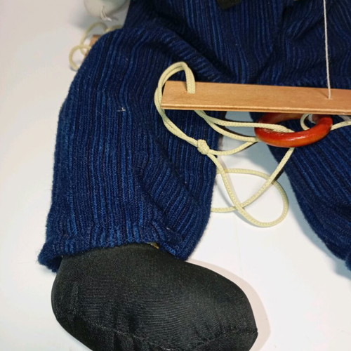 Marionette clown used with wooden control bar