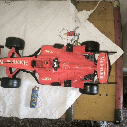 Formula 1 toy car with friction and sounds, red, like new