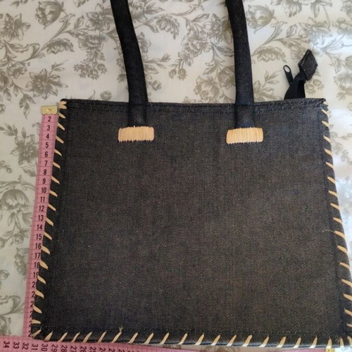 Denim shoulder bag with straw details