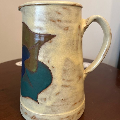 Handmade earthenware jug new with embossed floral pattern