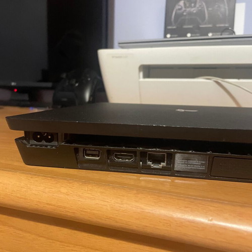 PS4 Slim console with 2 controllers and games