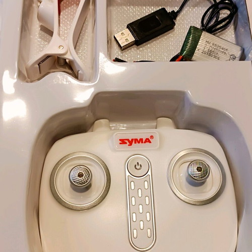 Syma X15W drone used with remote control and video mount
