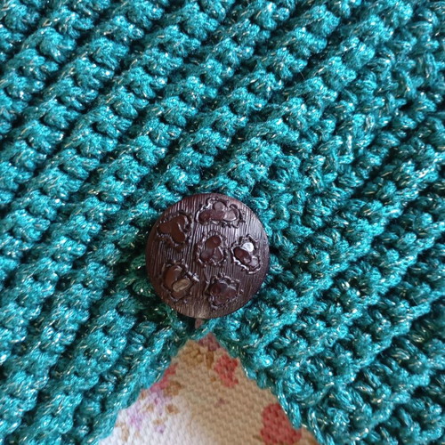 Handmade knitted handbag in turquoise green
