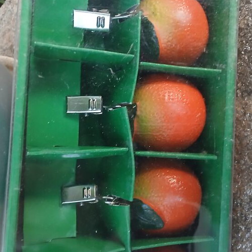 Tablecloth weights with orange design