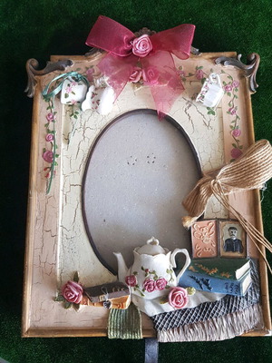 Frame with hanging decorations used, broken support