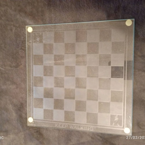 Glass chessboard used, missing one rook