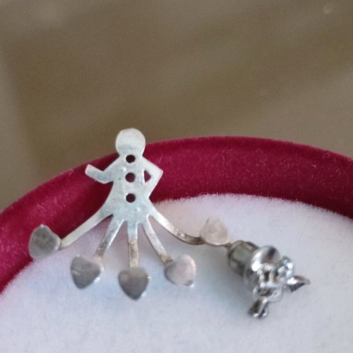 Silver earring that hugs the ear from below