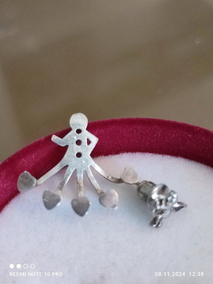 Silver earring that hugs the ear from below