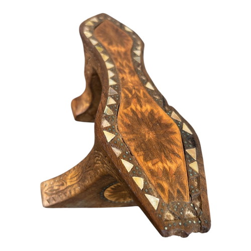 Wooden handmade ethnic decoration with mother of pearl used