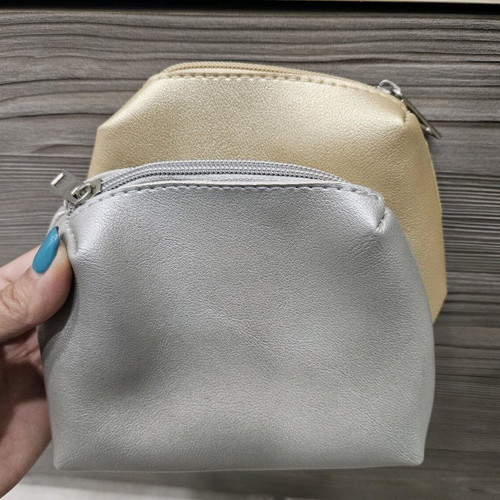 Small toiletry bags like new, gold and silver