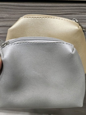Small toiletry bags like new, gold and silver
