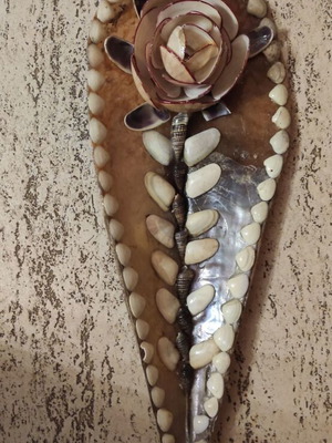 Decorative wall plaque with shell decoration handmade