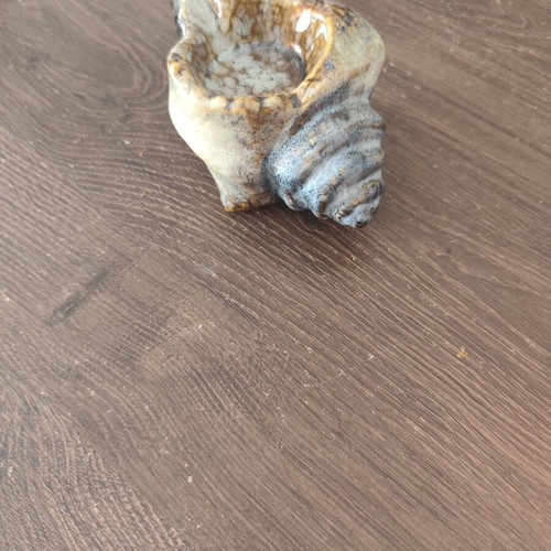 Ceramic ashtray in shell shape used