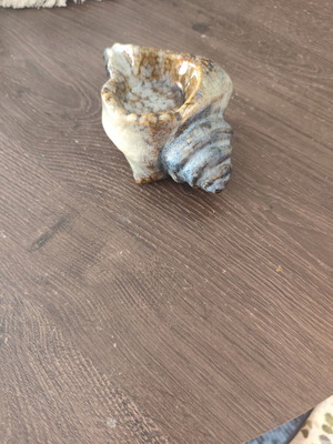 Ceramic ashtray in shell shape used