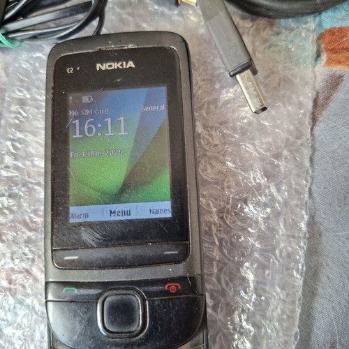 Nokia C2-05 phone with charger, headphones and data cable