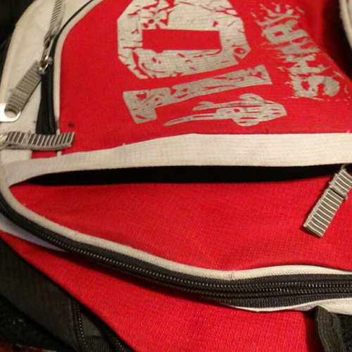 School bag used, red with multiple compartments