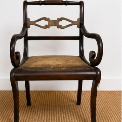 Vintage solid wood armchair with carved back used