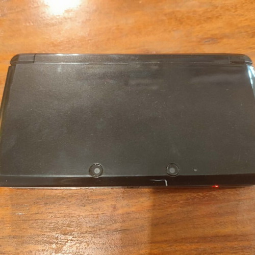 Nintendo 3DS console with charger, memory card and stylus