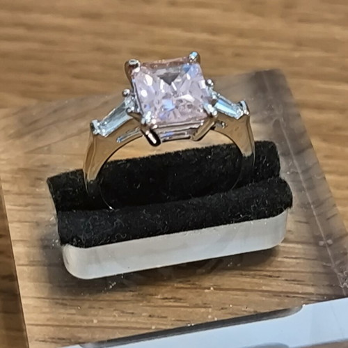 Ring with pink rectangular zircon and silver plating