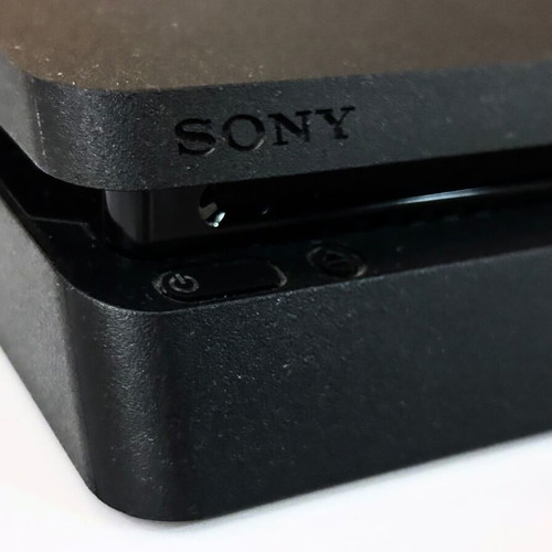PlayStation 4 Slim 500GB like new with headset and 2 controllers
