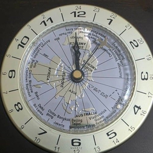 Luxury analog desk clock with world map and airplane needle