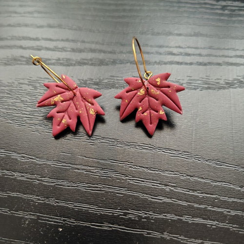 Red and gold leaf-shaped dangle earrings