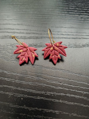 Red and gold leaf-shaped dangle earrings