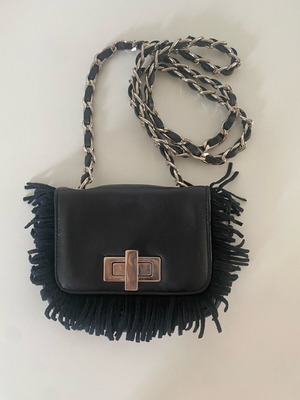 Le Solim leather shoulder bag like new, black with suede fringes