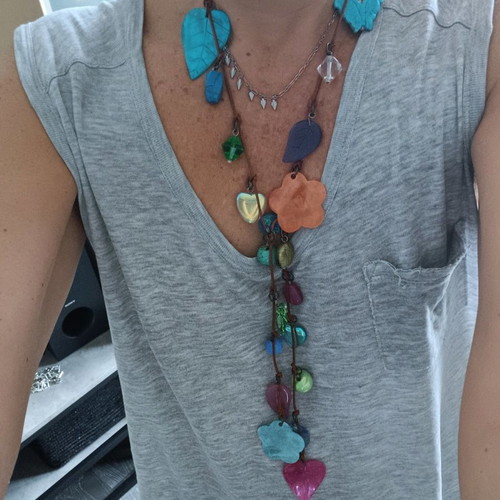 Necklace with leather and various elements used