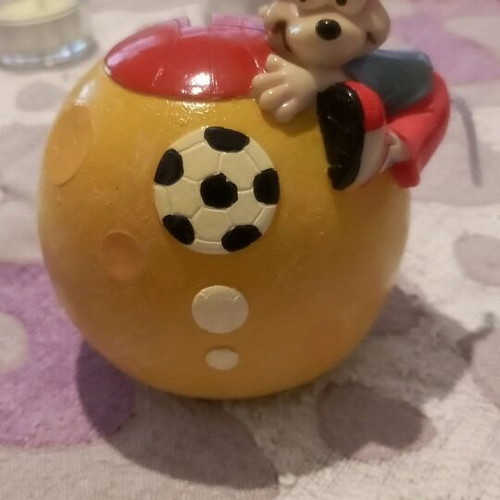 Ceramic piggy bank used with bottom opening