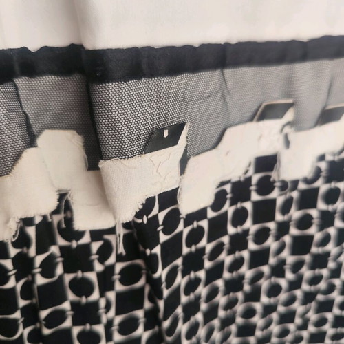 Two-tone dress used with embossed details