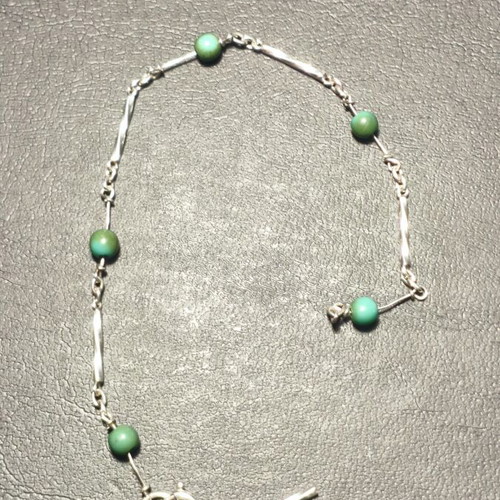 Silver bracelet with green beads used, needs repair