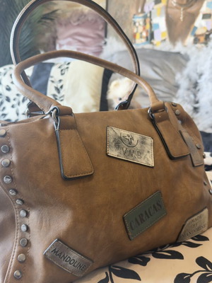 Large camel leather handbag like new with decorative buckles