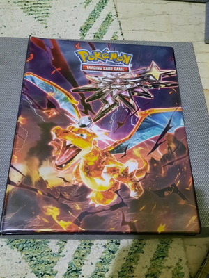 Pokemon collection used with cards, figures, tazos and Charizard binder 14 pages