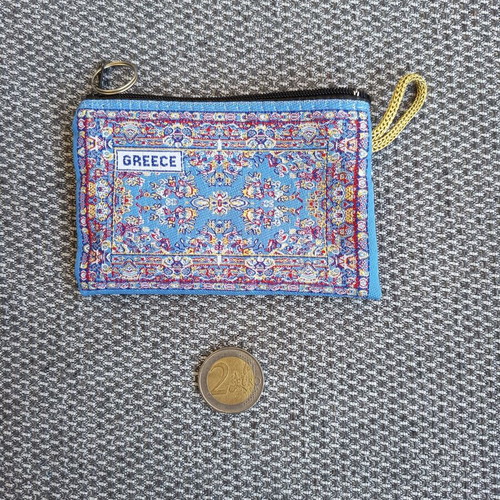 Wallet with traditional carpet pattern used, small and elegant