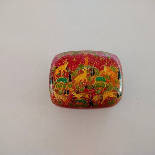 Decorative papier-mache box used with colorful patterns