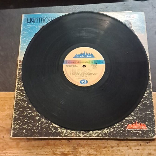 Lighthouse Sunny Days record used, good condition