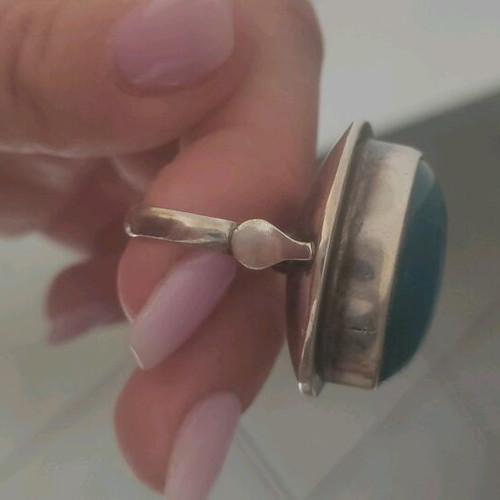 Silver large ring with petrol oval stone used
